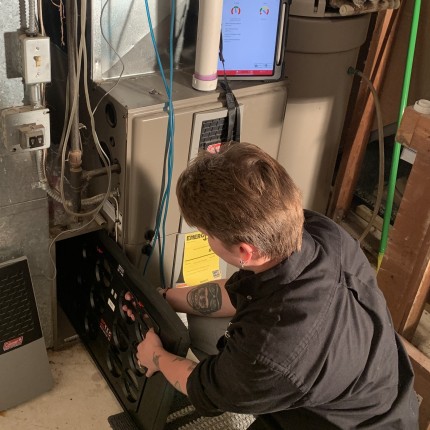 CEE staff performing duct diagnostic test