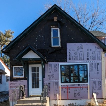 house getting exterior insulation