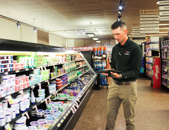 CEE staff member conducting energy analysis on a commercial business