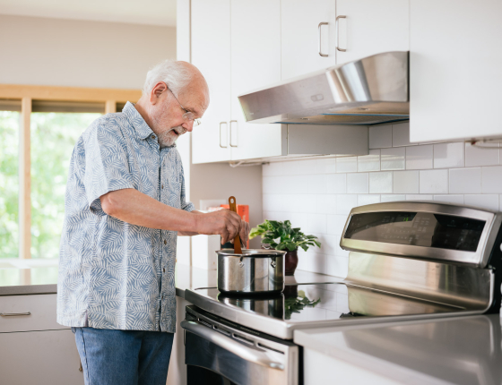 man cooking on an induction stove