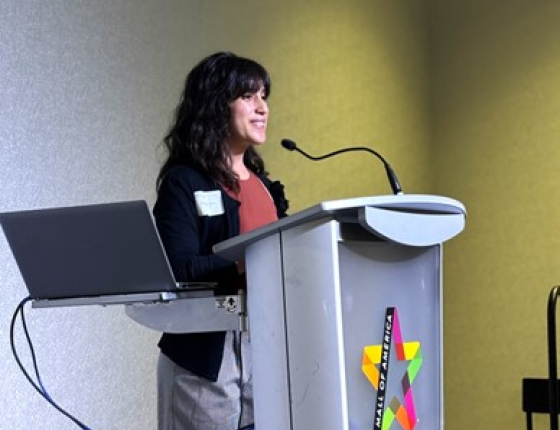 Ana De La Torre giving a presentation at CEE's all-staff meeting