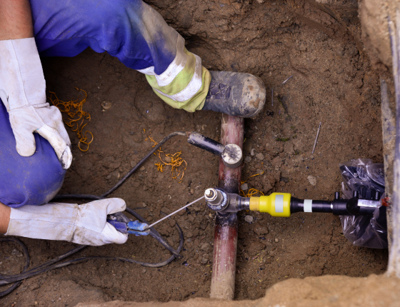 man welding a gas pipe