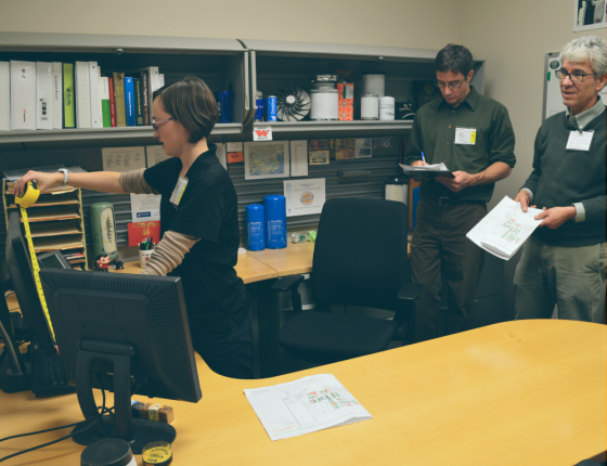 women measuring a desk space