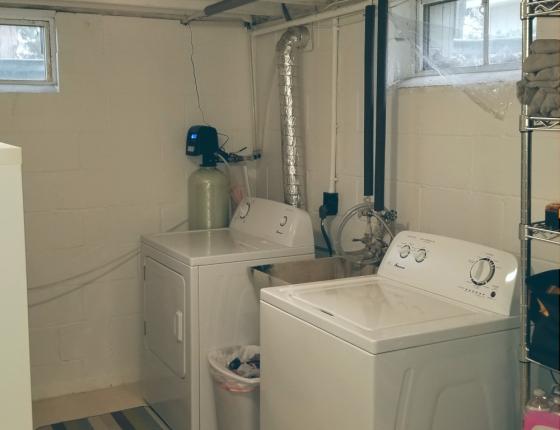 water and dryer in a basement