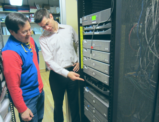 Two men inspecting a data center