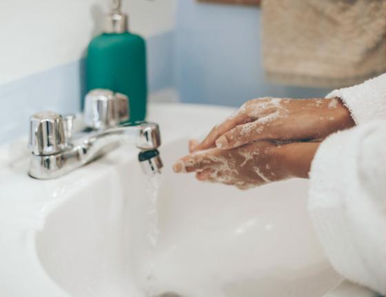 person washing their hands