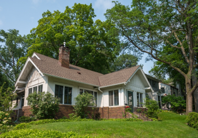 house on hill with trees