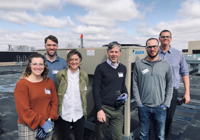 group of researchers on rooftop