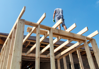 person on top of a construction project