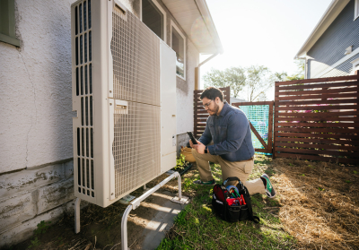 CEE staff working on air source heat pump