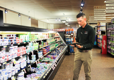 CEE staff member conducting energy analysis on a commercial business