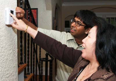 CEE staff assisting homeowner