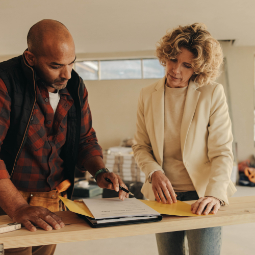 two people working on a home