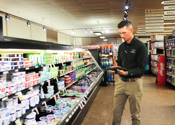 CEE staff member conducting energy analysis on a commercial business