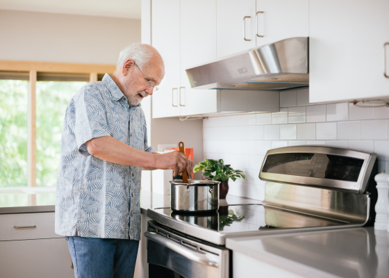 man cooking on an induction stove