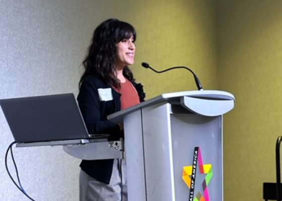 Ana De La Torre giving a presentation at CEE's all-staff meeting