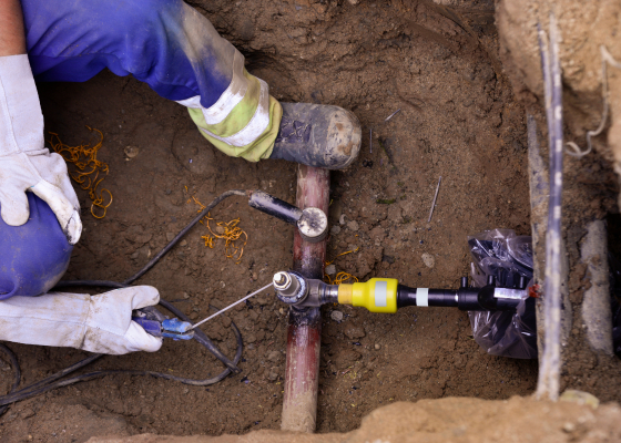 man welding a gas pipe