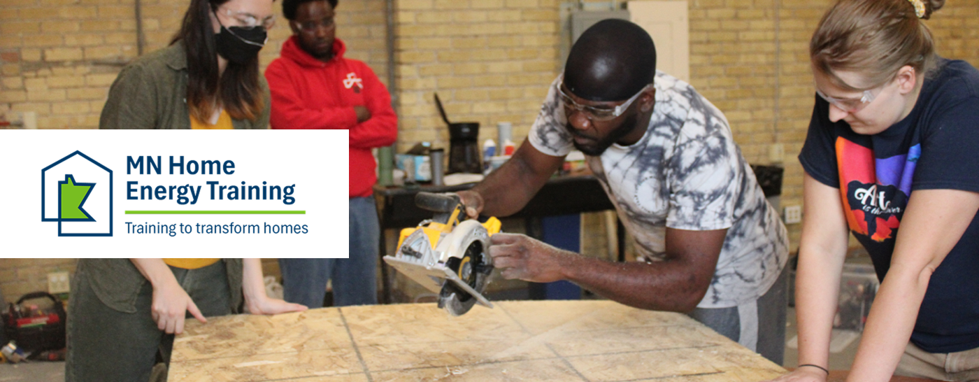 training program participants watching person use a saw