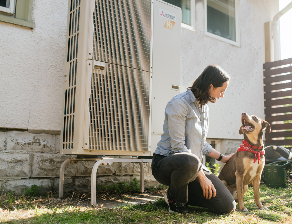 person outside with heat pump