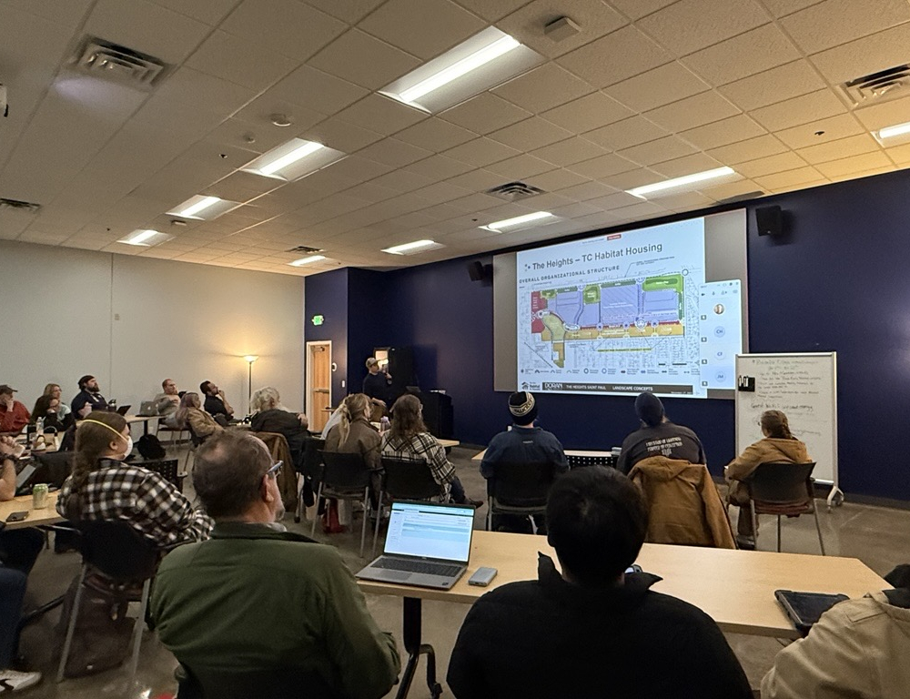 A CEE employee presents to an audience about ratings and certifications in a redevelopment project.
