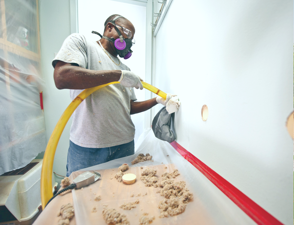 man installing insulation