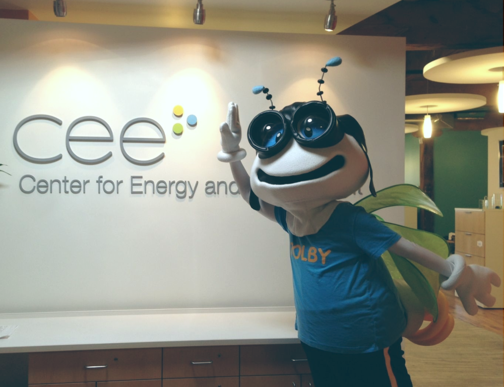 TOLBY posing in front of the CEE sign
