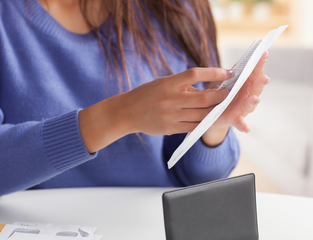 Woman filing envelope