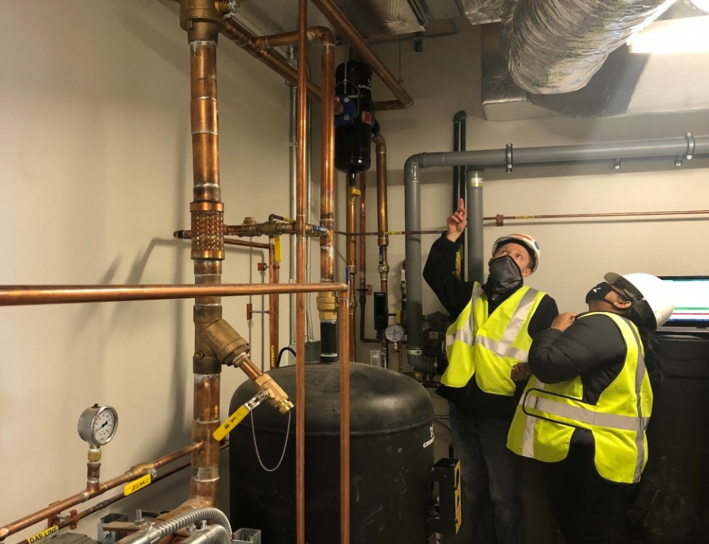 Cody and Rinika monitoring energy use at job site