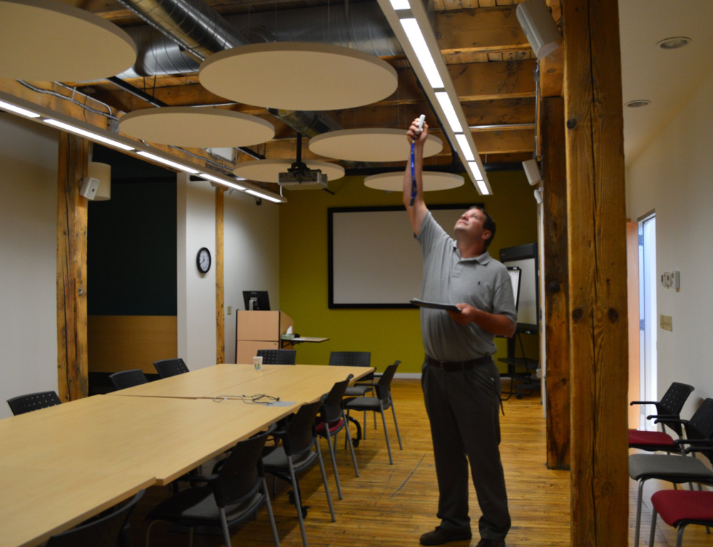 worker checking lightbulbs