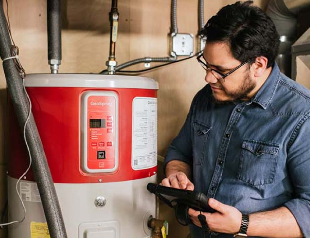 person looking at waterheater
