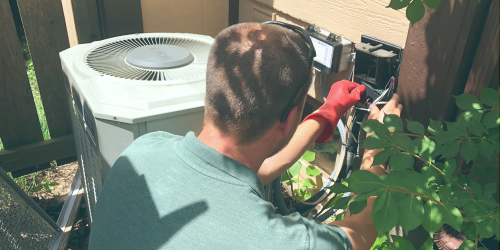 man installing AC