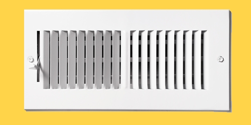 heating vent on yellow wall