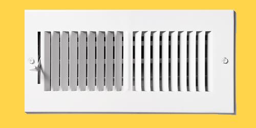 heating vent on yellow wall