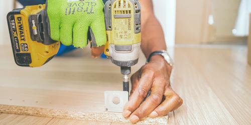 man drilling wood 