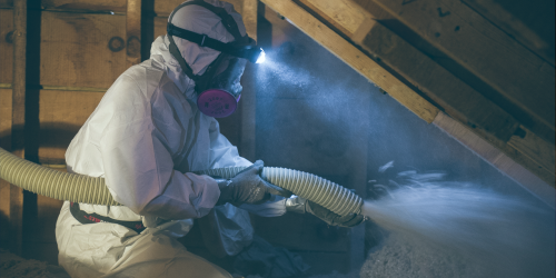 person installing insulation