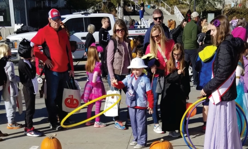 children in costumes walking around