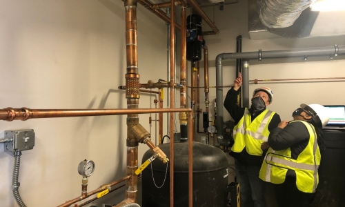 Cody and Rinika monitoring energy use at job site