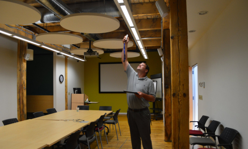 worker checking lightbulbs