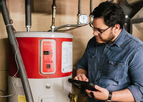 person looking at waterheater