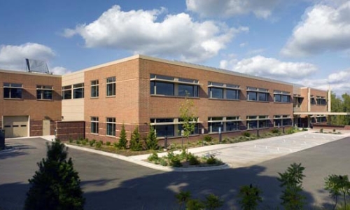 large commercial building in parking lot