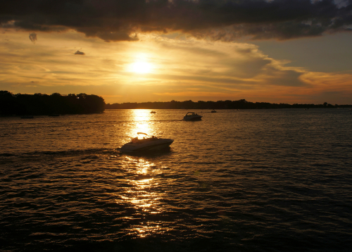 sunset over lake Minnetonka with boats on lake