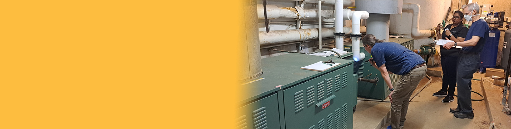 a group of engineers checking out machinery 