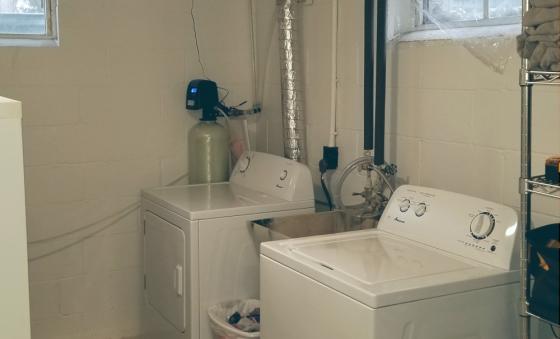 water and dryer in a basement