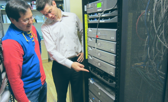 Two men inspecting a data center