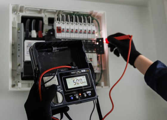 electrician testing electrical panel