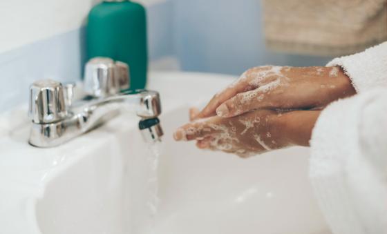 person washing their hands